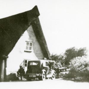1930s The Crooked Cottage with district nurse Tipples c