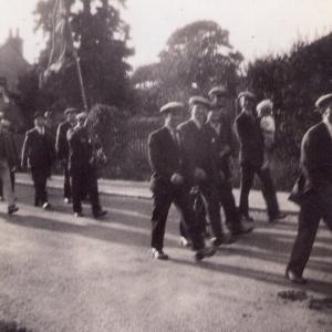 1940 45 Possibly Newmarket. Members of the Moulton Home Guard parade. Mr Turner carrying son Ken is on the far side..