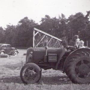 1950s Trinity Hall farm at Folly Hill racecourse boy on tractor Bob Saltmarsh