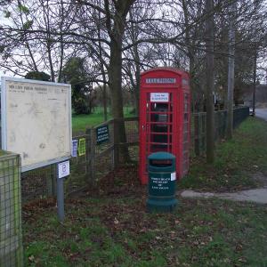 2010 24 11 The Street footpath map litter bin telephone 