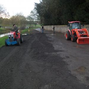 2021 22 01 Brookside Douglas James and Bill Rampling putting a hard surface.